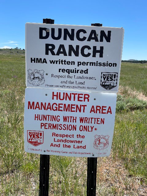 A photo of a sign saying that the the area is a Hunter Management Area - and that hunting is only allowed with written permission. 