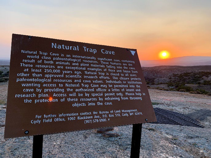 A photograph of the National Park Service Sign at Natural Trap Cave. 